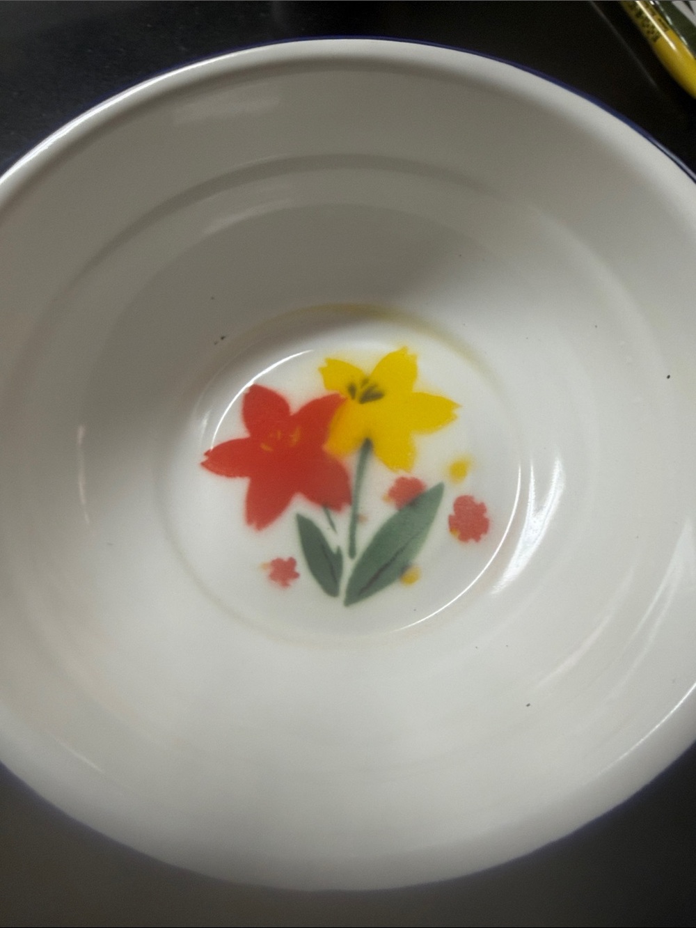 White Ceramic Bowl with Red and Yellow Floral Motif